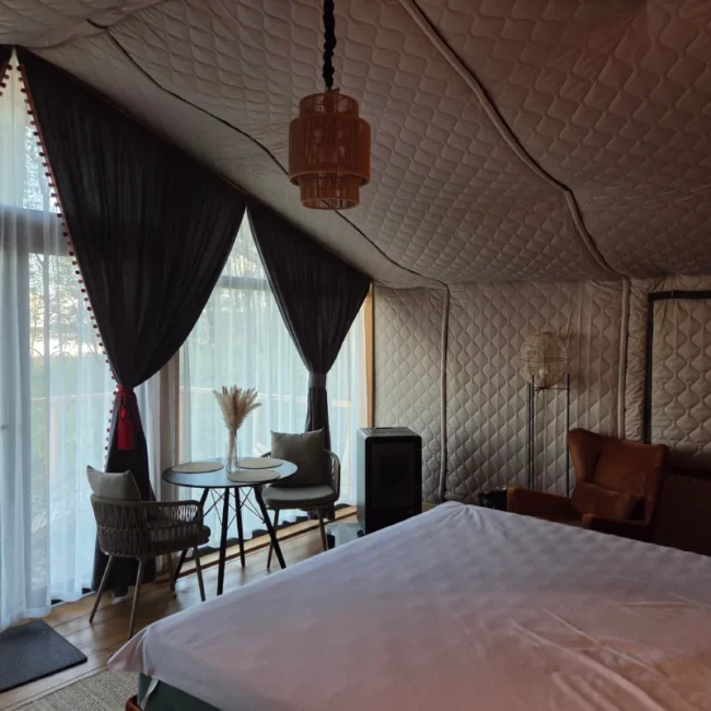Bedroom inside a family glamping tent