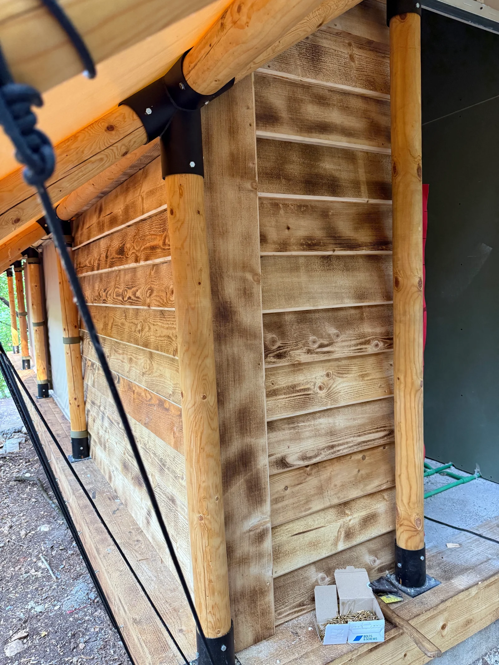 Exterior construction of the private bathroom section on a Wildhomes Safari tent